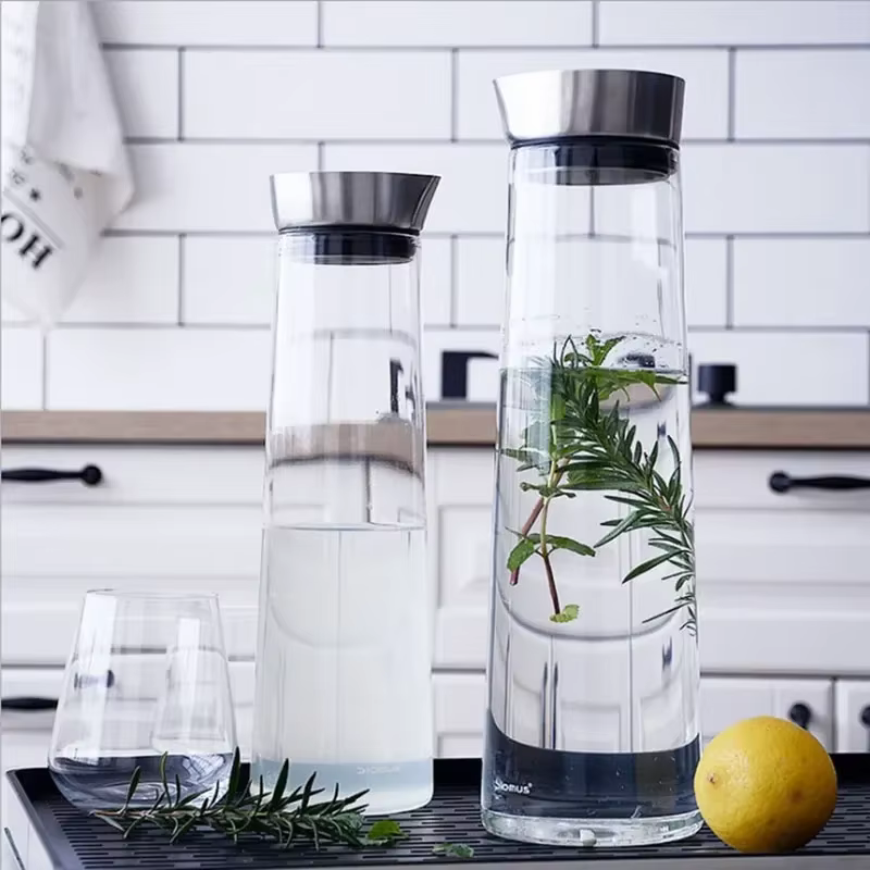 Grande bouteille d'eau en verre épaissie avec couvercle en acier inoxydable