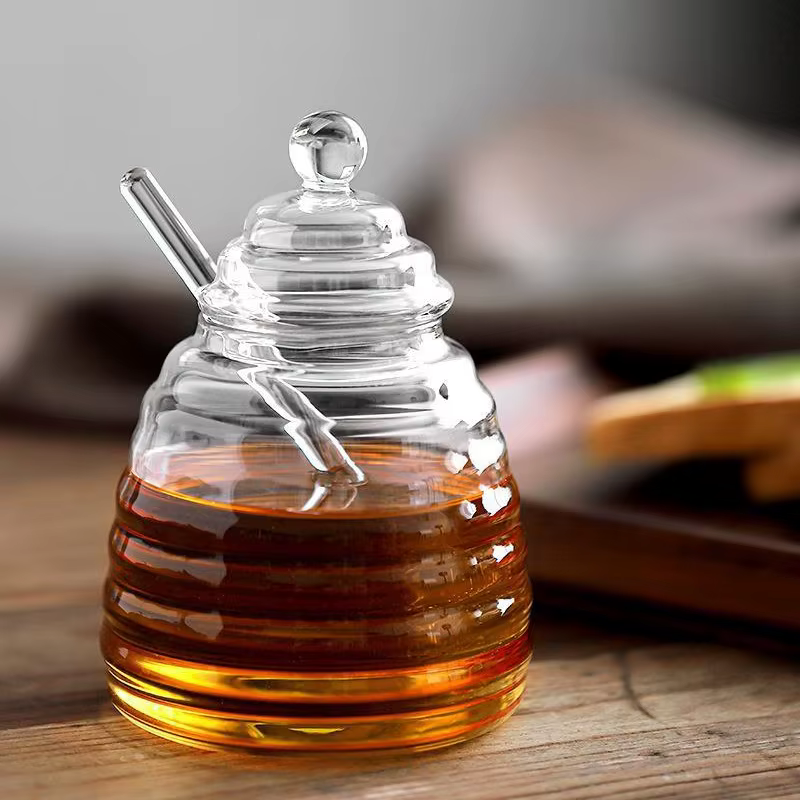Récipient de stockage de miel précieux en accent d'abeille en verre avec louche et couvercle