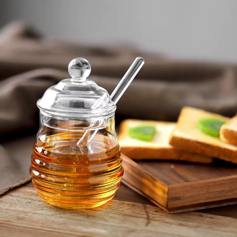 Récipient de stockage de miel précieux en accent d'abeille en verre avec louche et couvercle