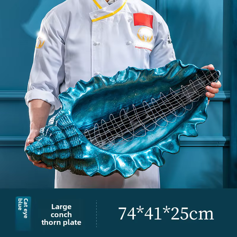 Assiette de service créative en forme de conque de fruits de mer