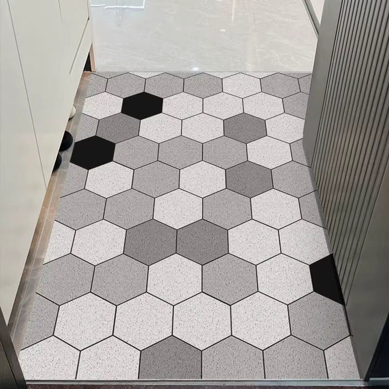 Le tapis de porte d'entrée peut être nettoyé avec un tapis de porte domestique en PVC. Le tapis d'entrée est un tapis de dessin animé résistant à la saleté
