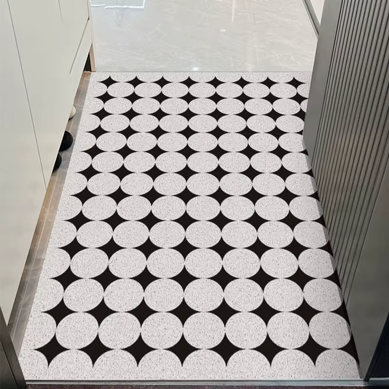 Le tapis de porte d'entrée peut être nettoyé avec un tapis de porte domestique en PVC. Le tapis d'entrée est un tapis de dessin animé résistant à la saleté