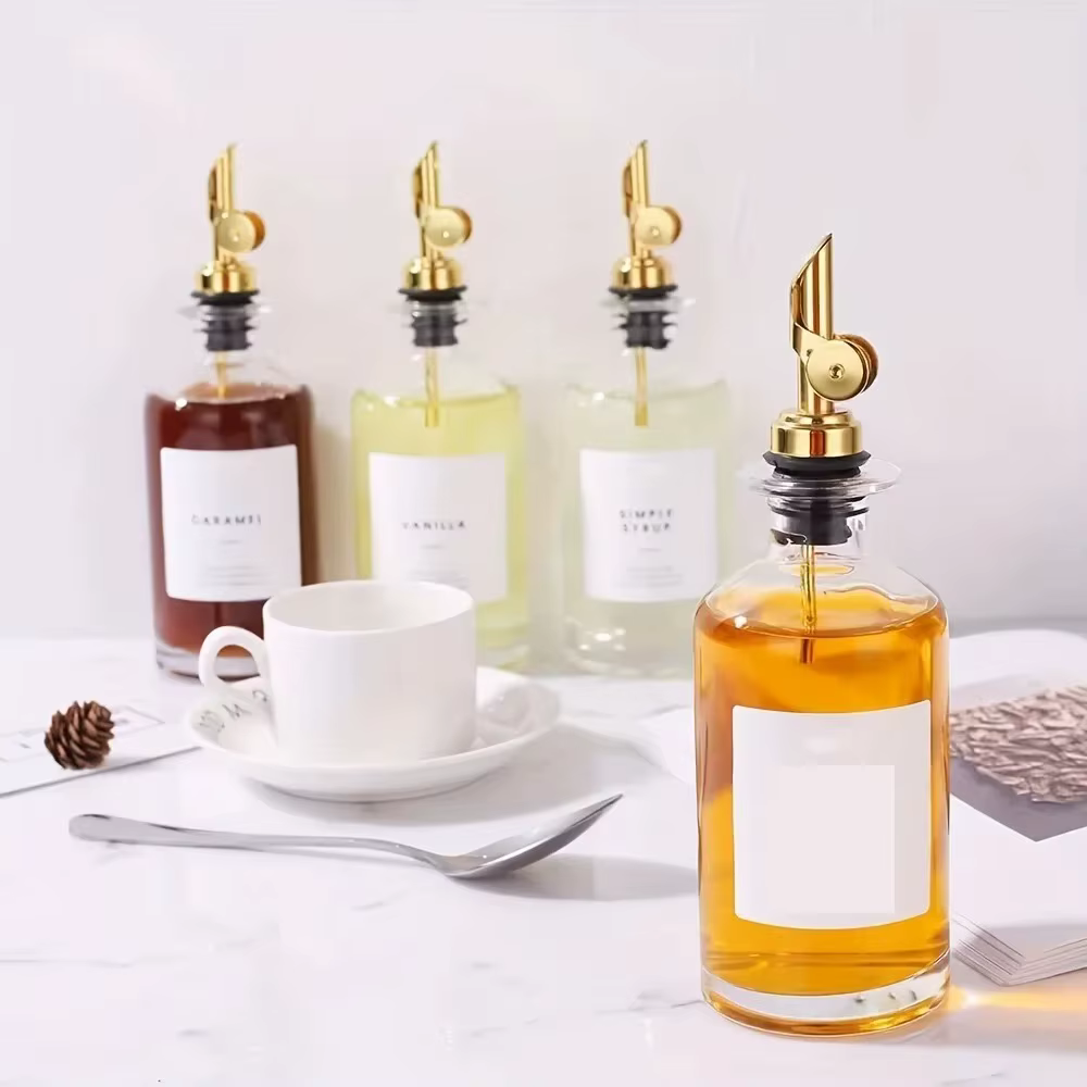 Bouteille distributrice d'huile d'olive en verre